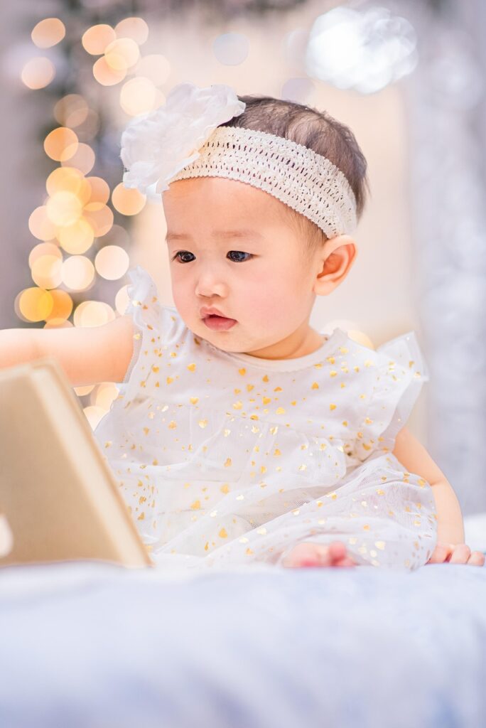 baby, girl, book, study, cuteness, bokeh lights, infant, baby girl, dress, baby dress, portrait, baby portrait, baby photoshoot, baby, baby girl, baby girl, baby girl, baby photoshoot, baby photoshoot, baby photoshoot, baby photoshoot, baby photoshoot